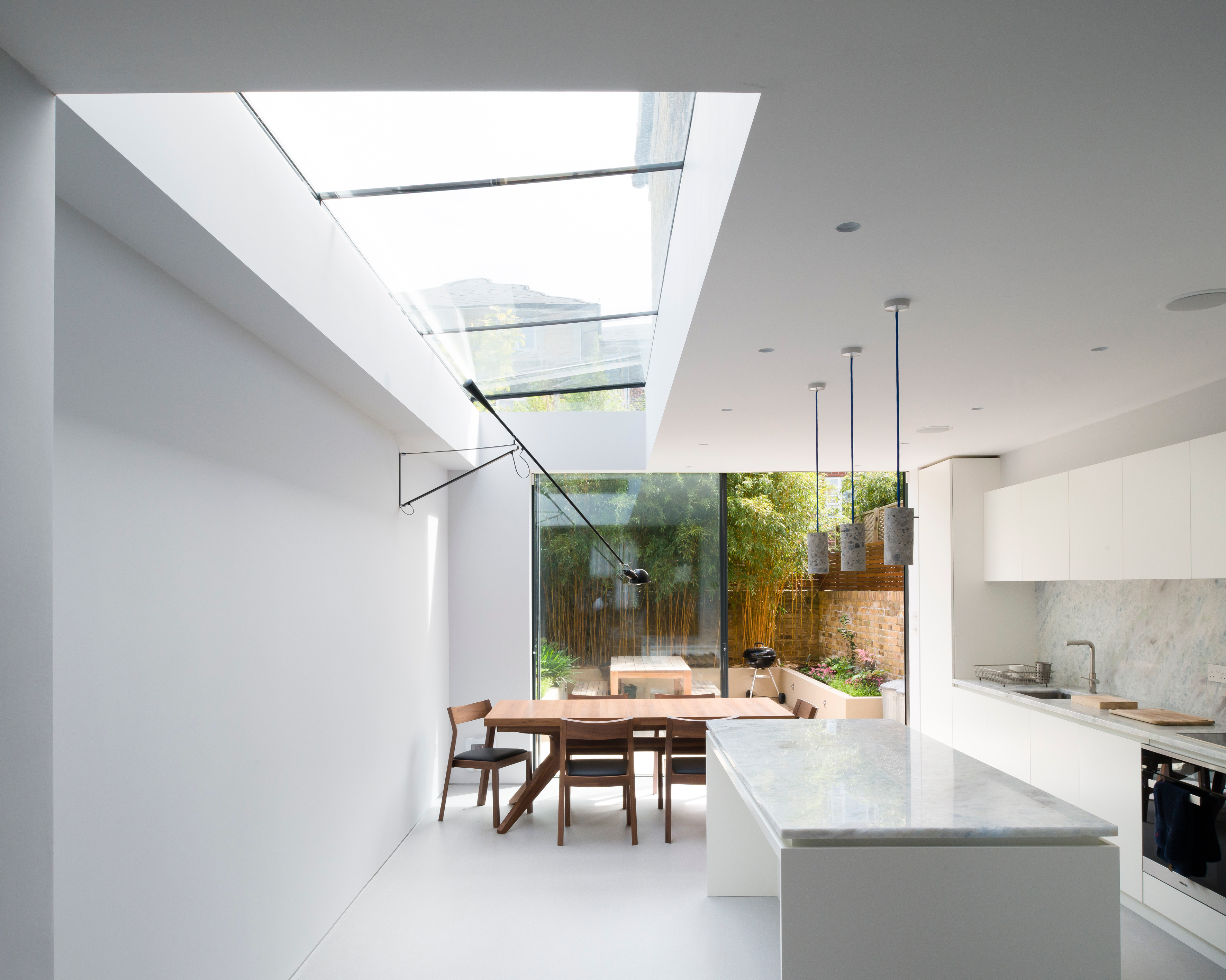 White resin kitchen floor with white walls and kitchen island