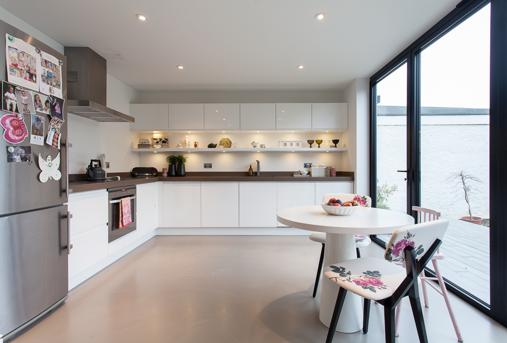 Warm light brown resin residential flooring in kitchen