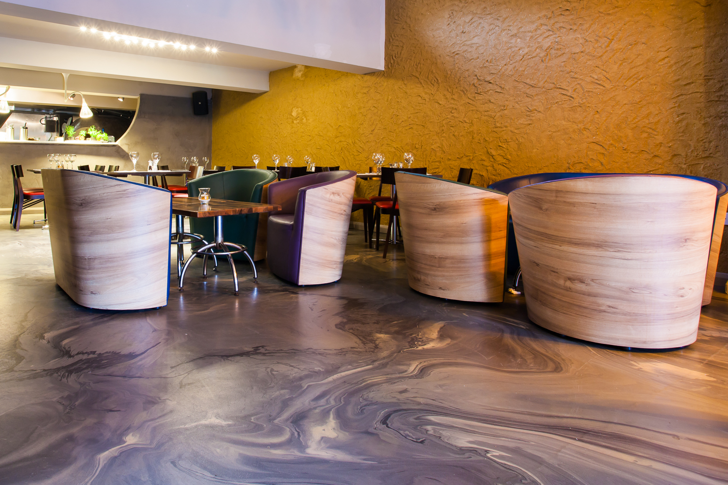 Grey and white marbled resin restaurant flooring with marbled chairs