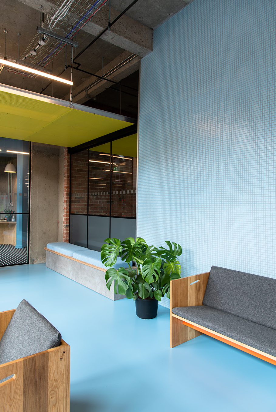 Blue resin floor for student accommodation, with light blue walls