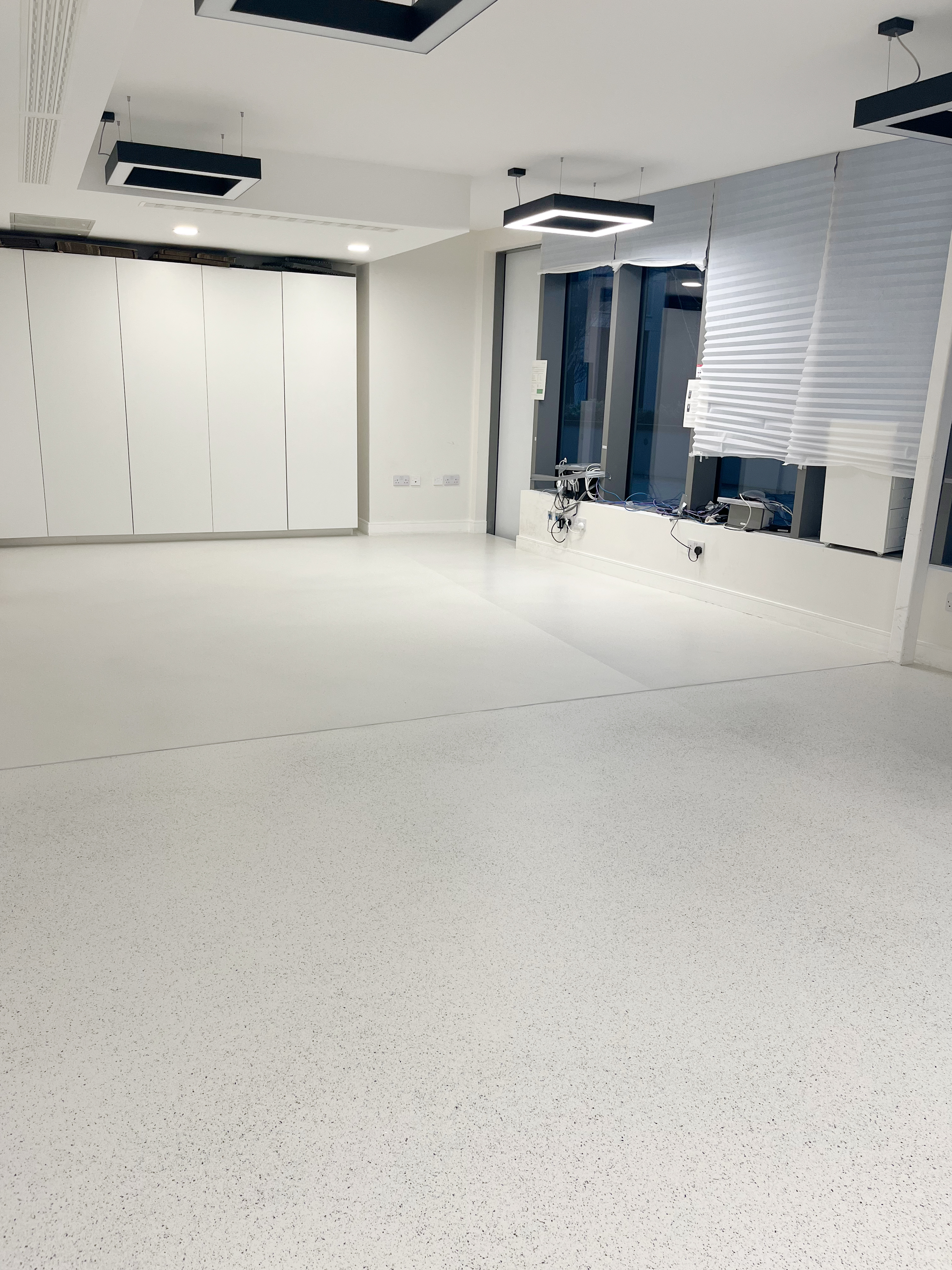 Wandsworth office with white terrazzo-effect resin floor spilt into two aggregate sizes