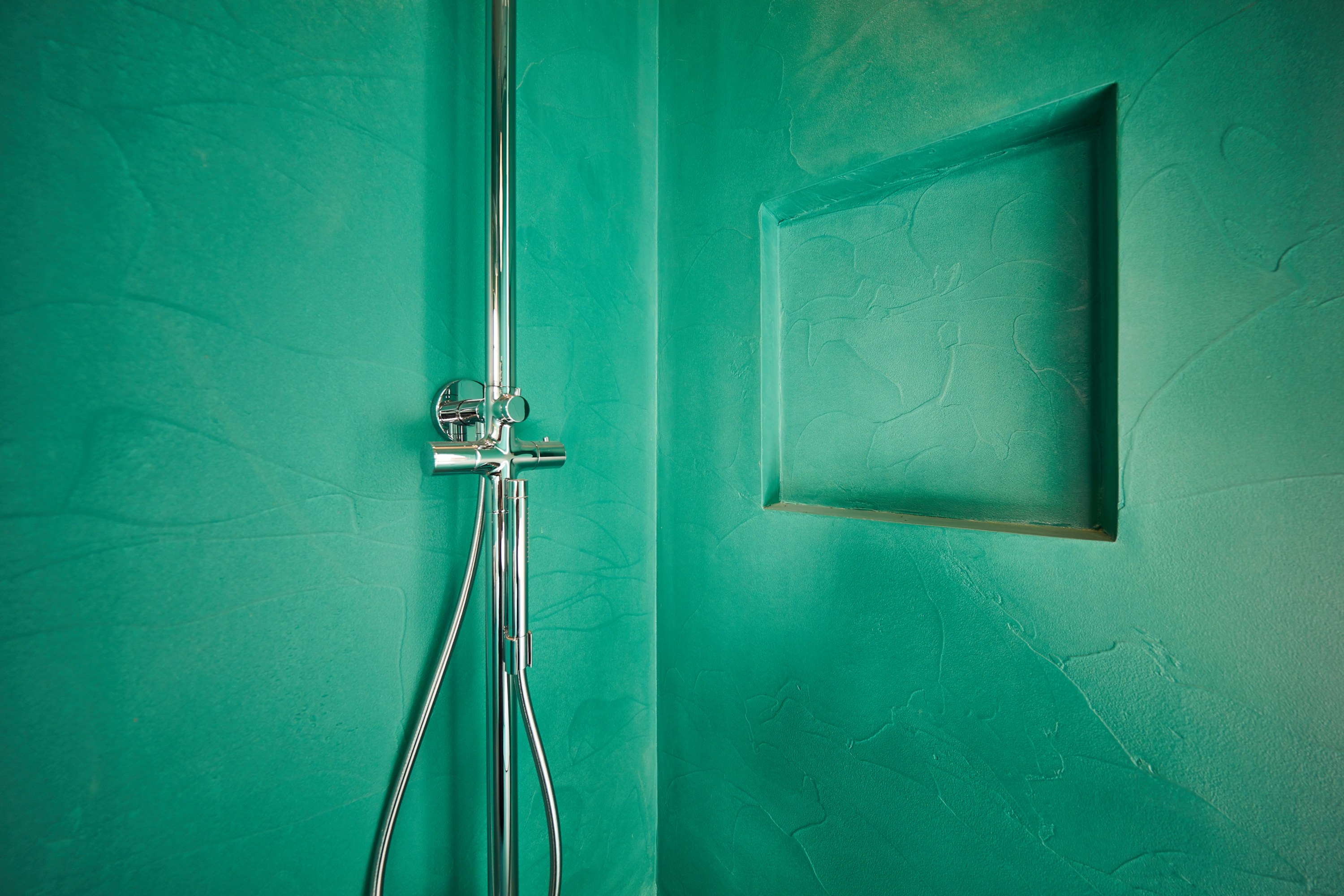 Turquoise resin bathroom wall finish