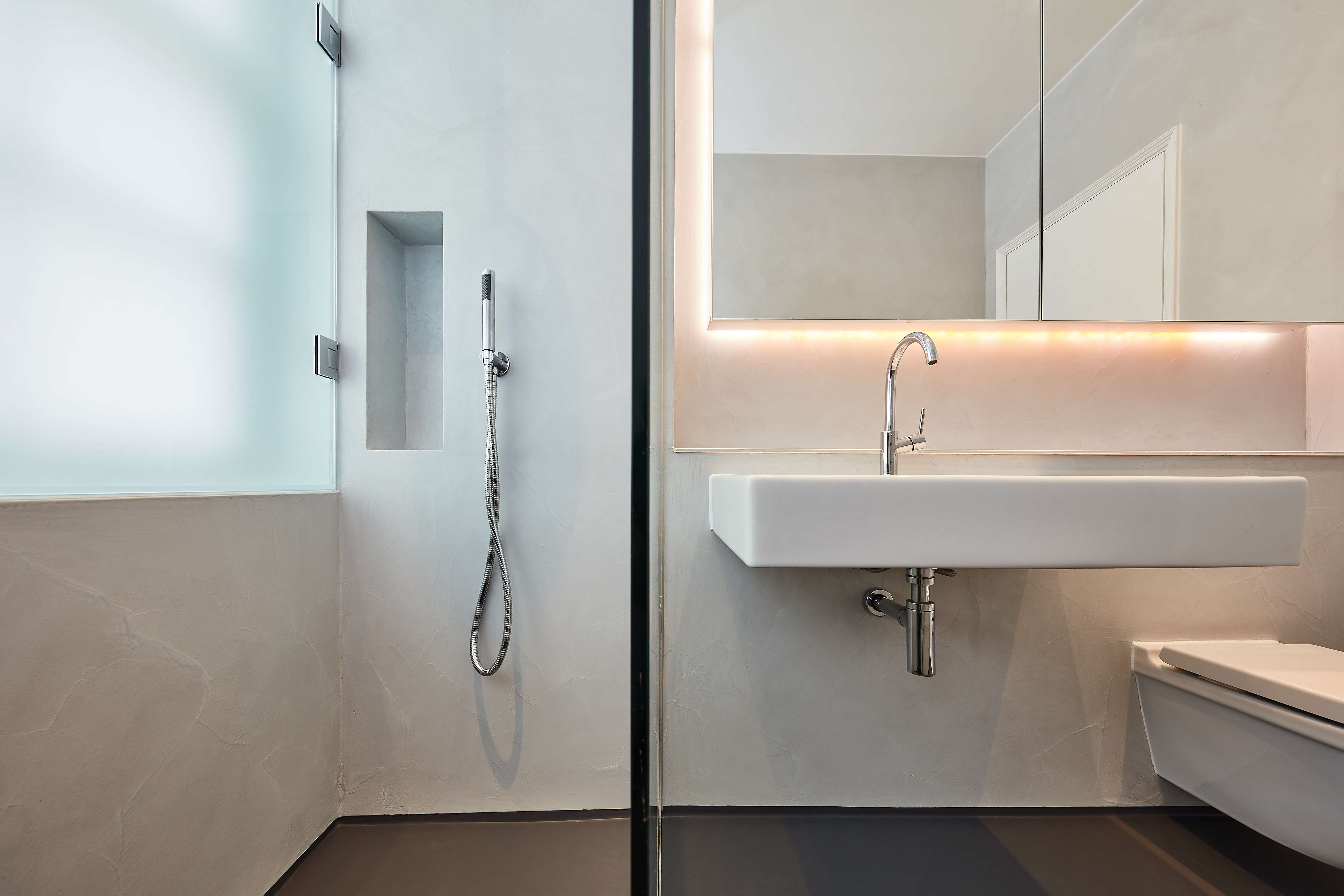 White and dark grey bathroom resin wall finish and floor 