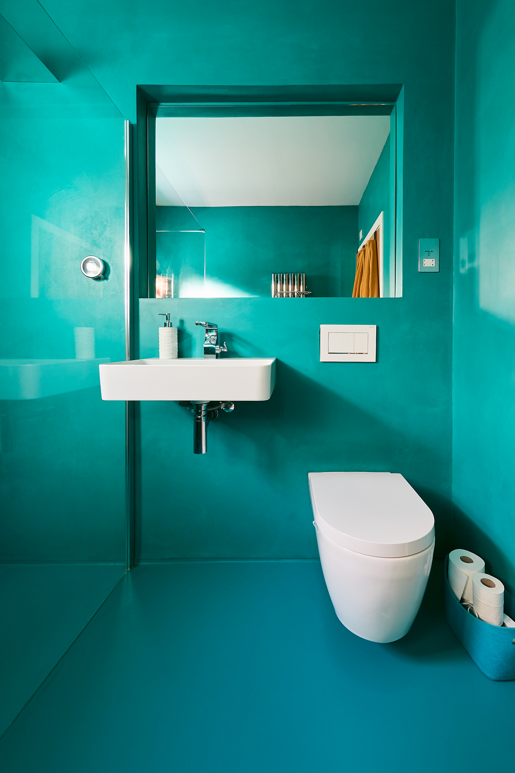 Turquoise matching bathroom resin wall finish and floor