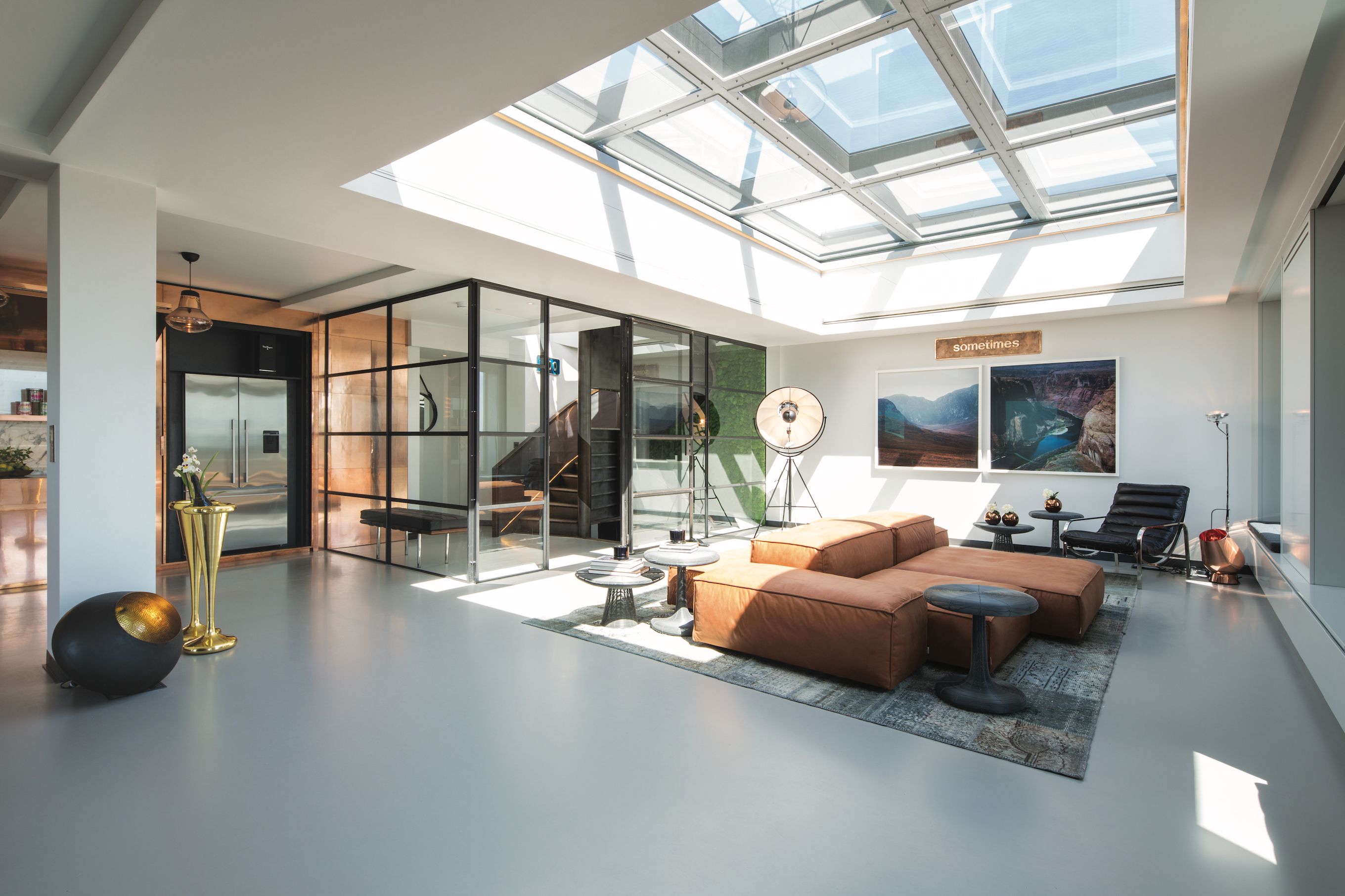 Solid grey resin floor in a living room with ceiling light