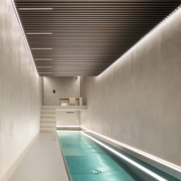 Warm grey resin floors and walls in a residential swimming pool