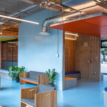 Blue resin floor for student accommodation, with light blue walls and furniture