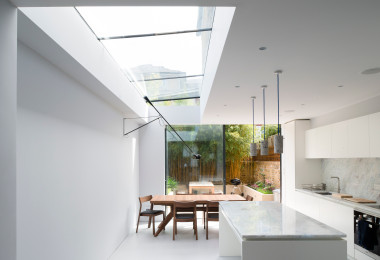 White resin kitchen floor with white walls and kitchen island