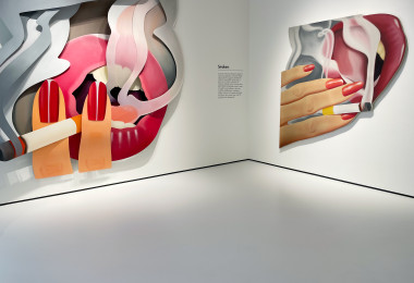 Light grey museum flooring with large artwork on the walls