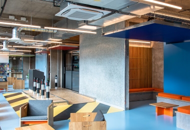 Blue resin floor for student accommodation, with light blue walls