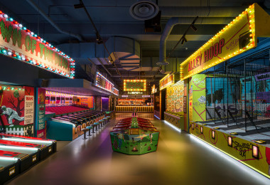 Grey resin commercial flooring in an indoor fairground