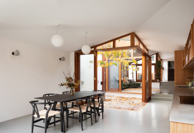 Grey resin dining room floor with black dining table