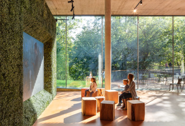 Orange-brown resin museum flooring with a screen playing a video