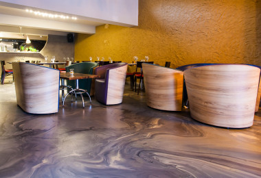 Grey and white marbled resin restaurant flooring with marbled chairs