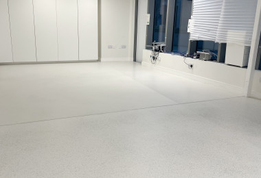 Wandsworth office with white terrazzo-effect resin floor spilt into two aggregate sizes