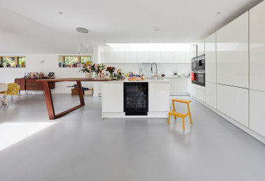 White resin kitchen flooring with white cabinets