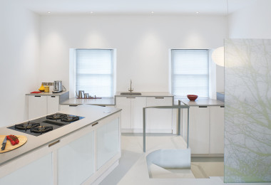 White resin residential flooring in kitchen