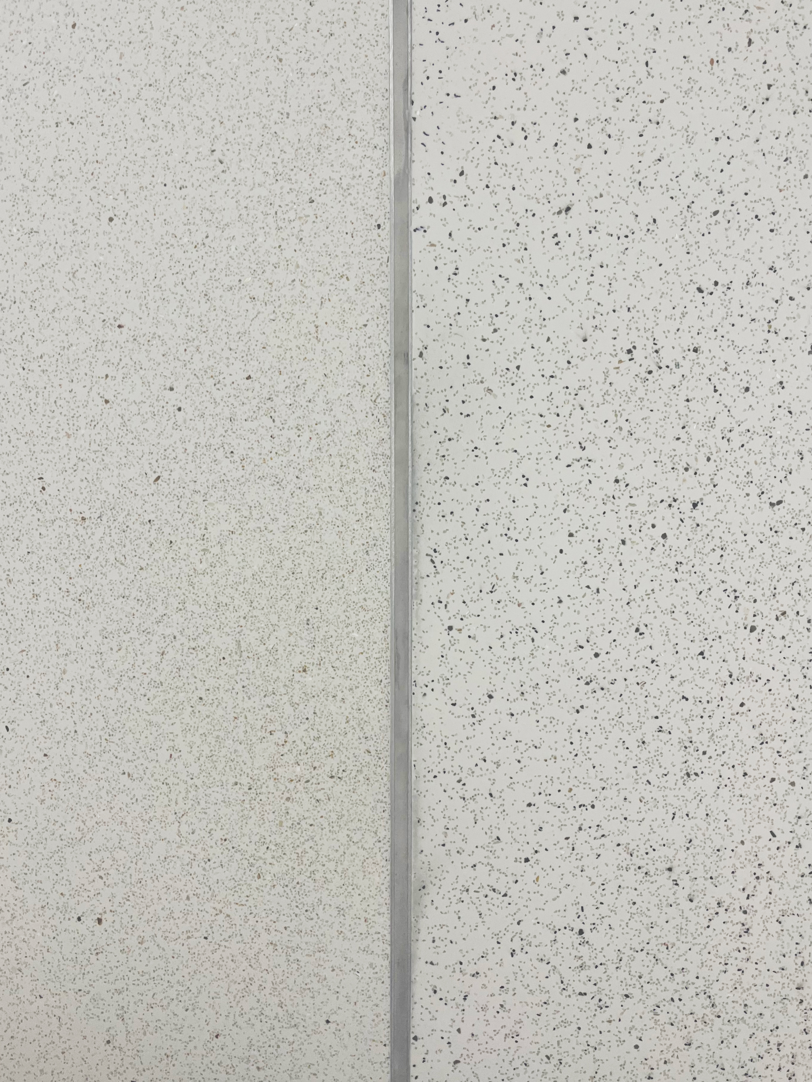 Wandsworth office with white terrazzo-effect resin floor split into two aggregate sizes