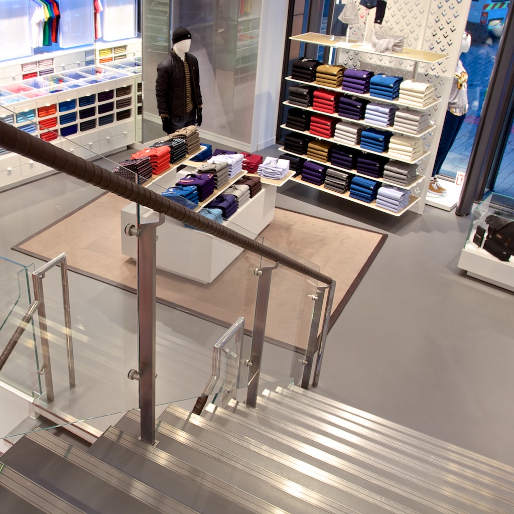 Grey resin retail floor in clothes store