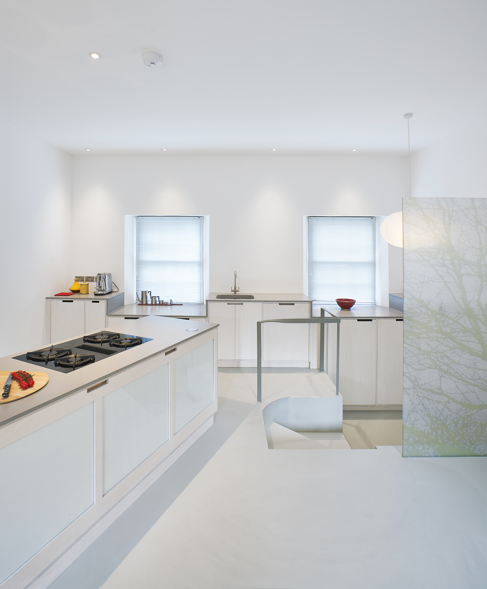 White resin residential flooring in kitchen