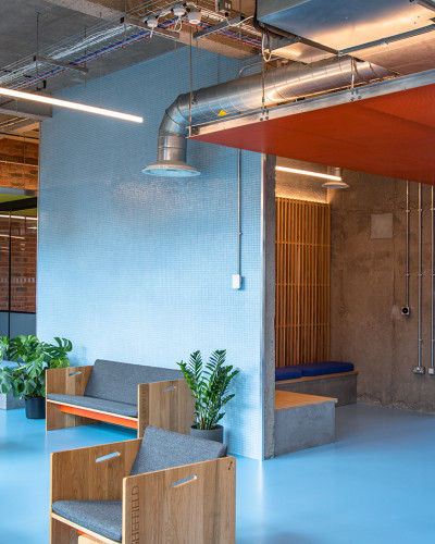 Blue resin floor for student accommodation, with light blue walls and furniture